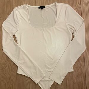 Dynamite Cream Long Sleeve Bodysuit